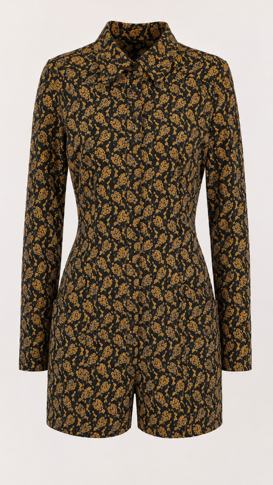 A long-sleeve short romper with a high collar, featuring an all-over dense floral and botanical print in mustard yellow and brown on a black base, shown against a plain light background.