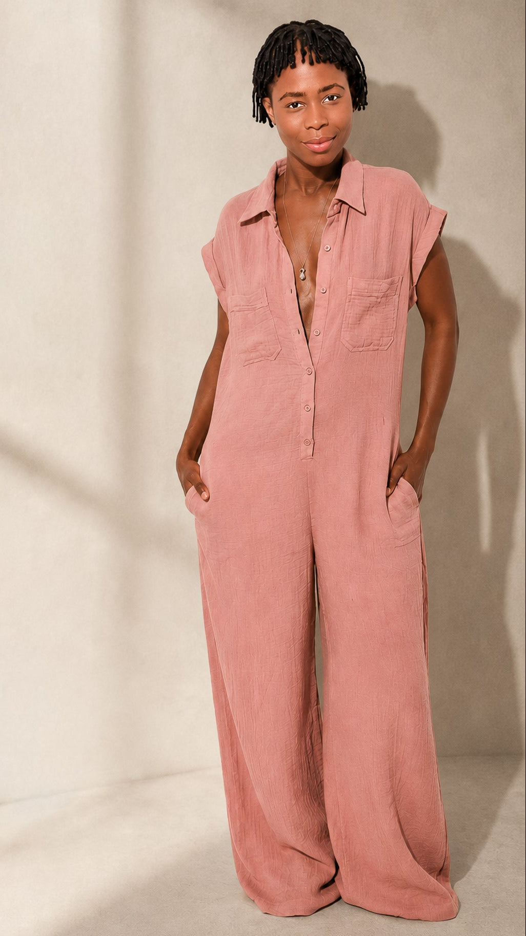 a picture of the dusty rose colored wide leg jumpsuit from the front view.